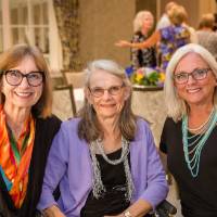 Three guests sitting together at Naples 2019